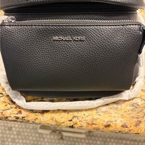Michael Kors Black leather sling pack